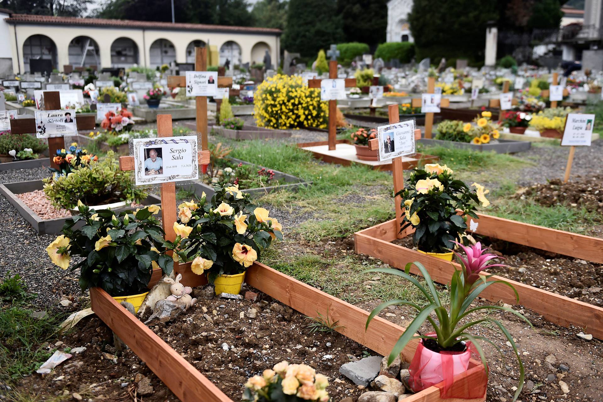 FILE PHOTO: Graves of people who had recently died due to COVID-19 are seen at the cemetery of Nembro, near Bergamo