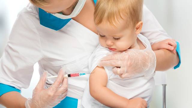 doctor does injection child vaccination baby