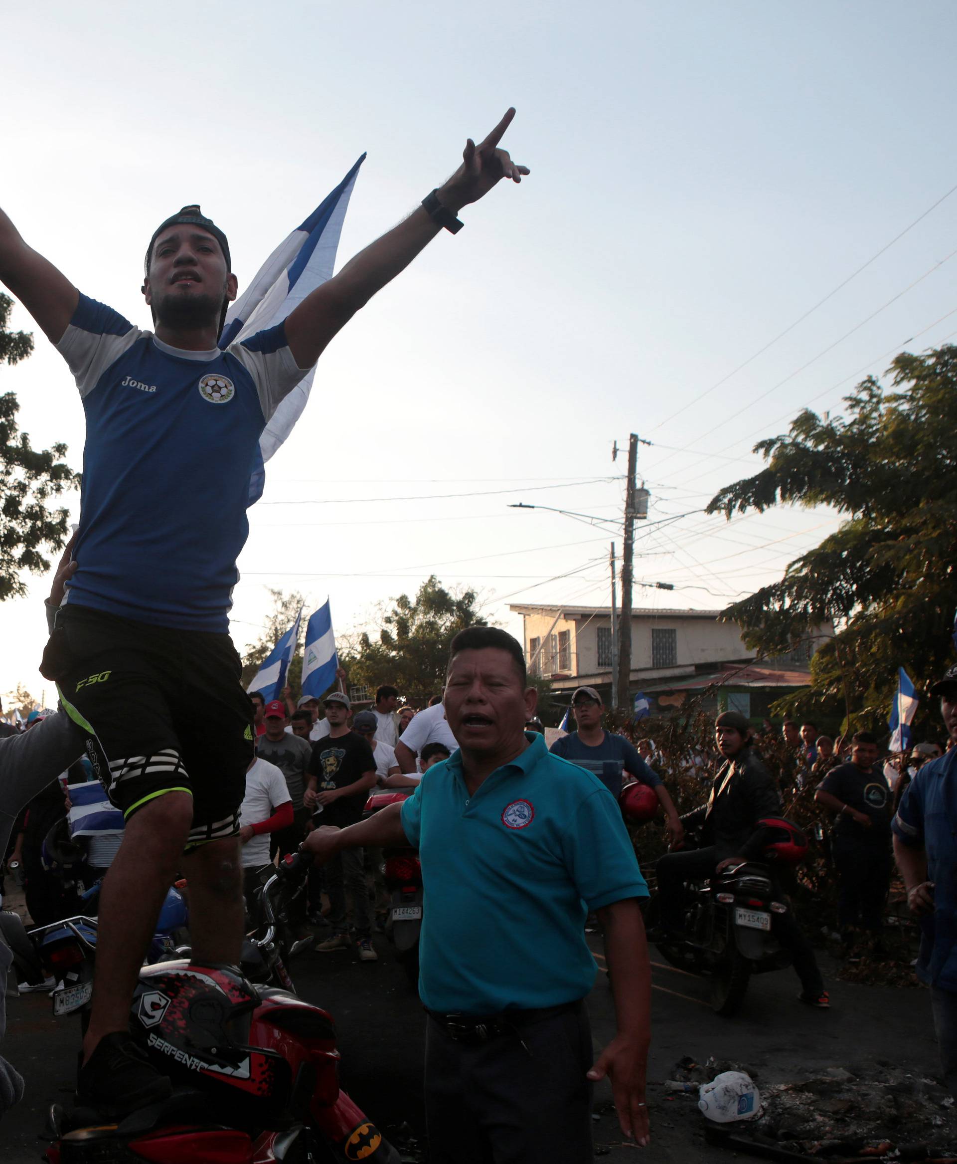 A demonstrator gestures during a protest against police violence and the government of Nicaraguan President Daniel Ortega in Managua