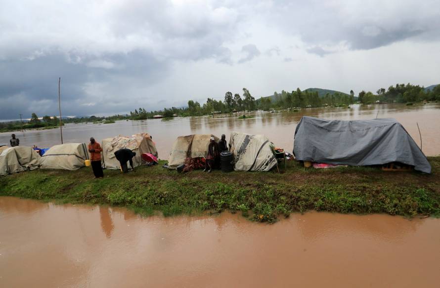 Residents set up makeshift shelter on a raised ground after they evacuated from their homes after River Nzoia burst its banks and due to the backflow from Lake Victoria