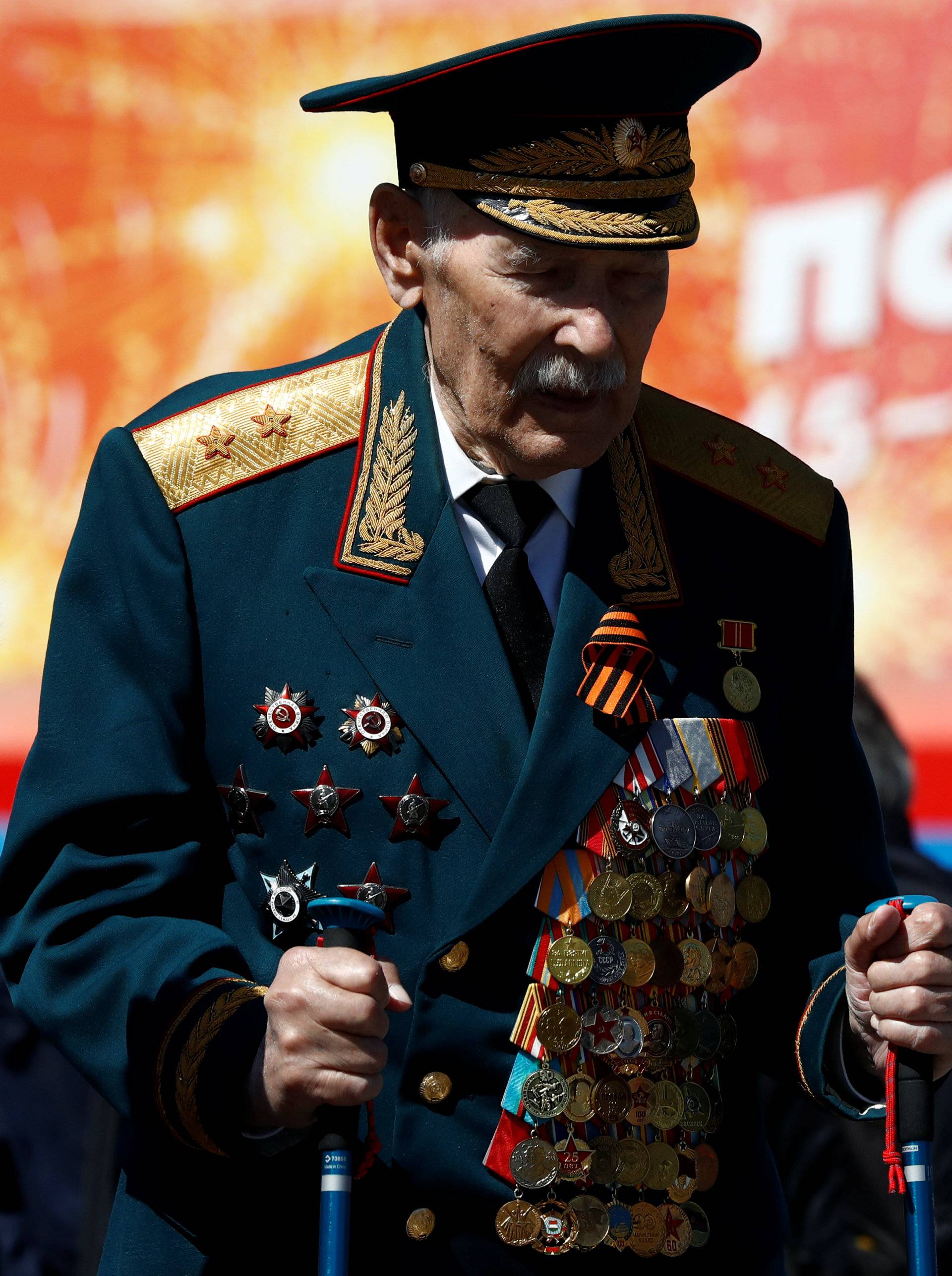 A veteran walks following the Victory Day parade at Red Square in Moscow