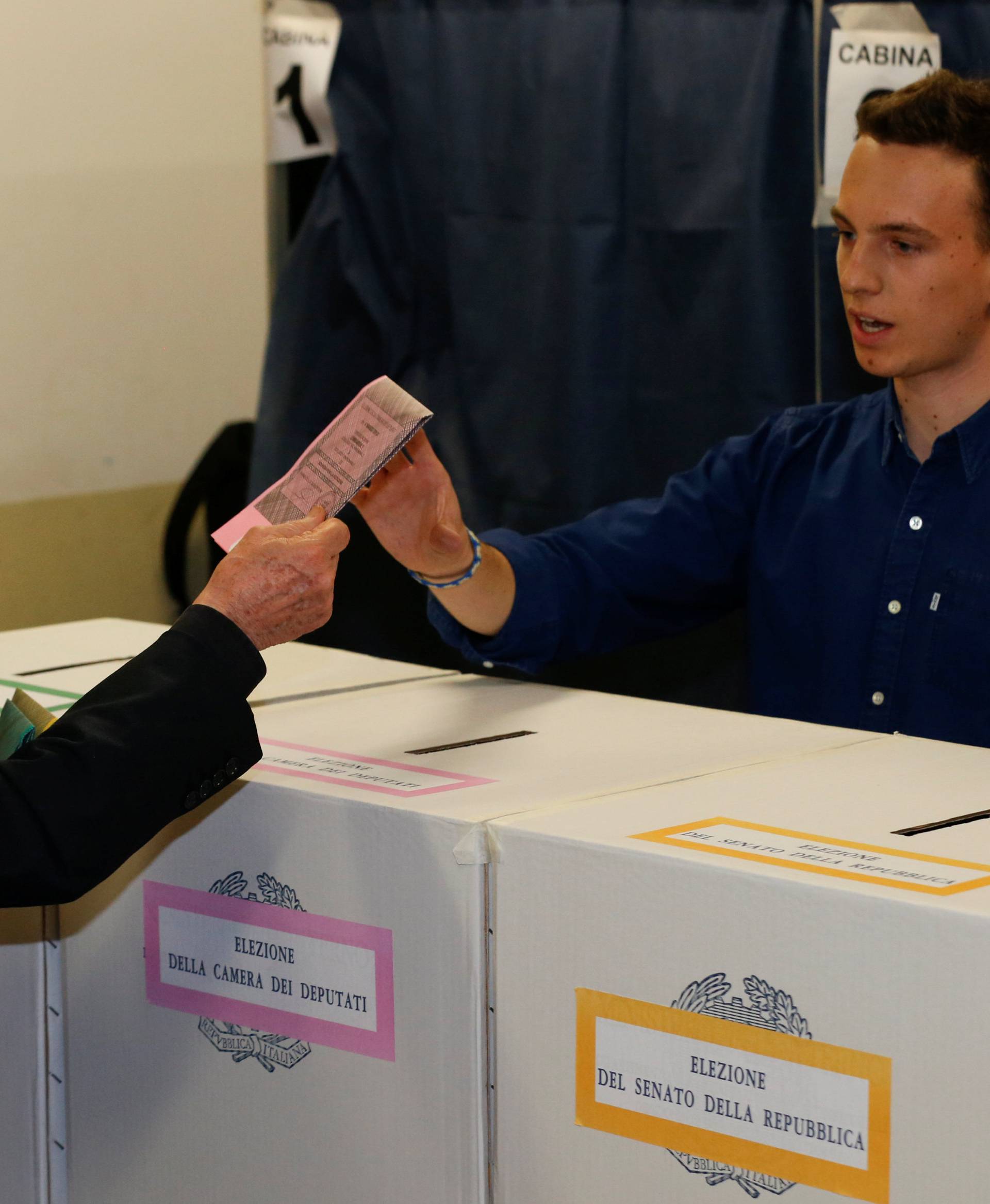 Forza Italia party leader Silvio Berlusconi casts his vote at a polling station in Milan