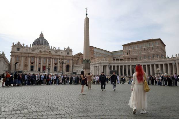 Kathrine Xiang walks St. Peter's Square as Pope Francis lies in state in St. Peter's Basilica, in the Vatican