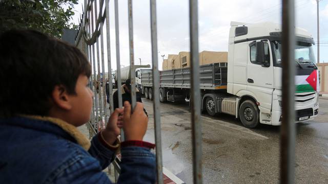 Trucks carrying containers and equipment for a Jordanian field hospital arrive through Rafah border crossing with Egypt, amid the ongoing conflict between Israel and Palestinian Islamist group Hamas, in Rafah