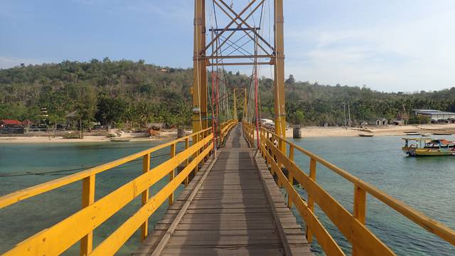 The "Yellow Bridge" which connects  Nusa Lembongan and Nusa Ceningan, two islands located east of the resort island of Bali, Indonesia