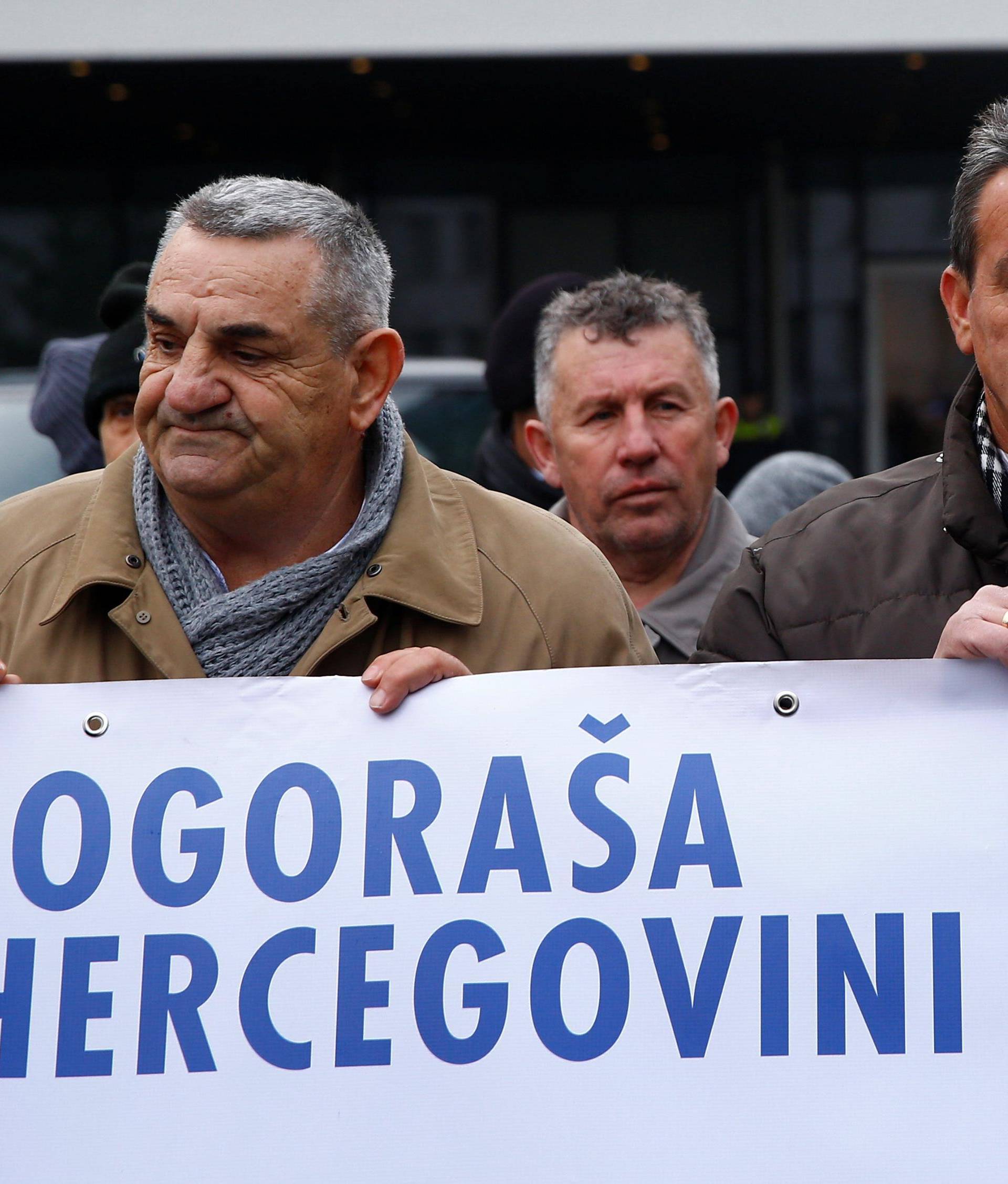 Fikret Alic, one of the survivors of concentration camps shows his photo on the cover of Time before the trial of former Bosnian Serb military commander Ratko Mladic before a court at the International Criminal Tribunal for the former Yugoslavia (ICTY) in