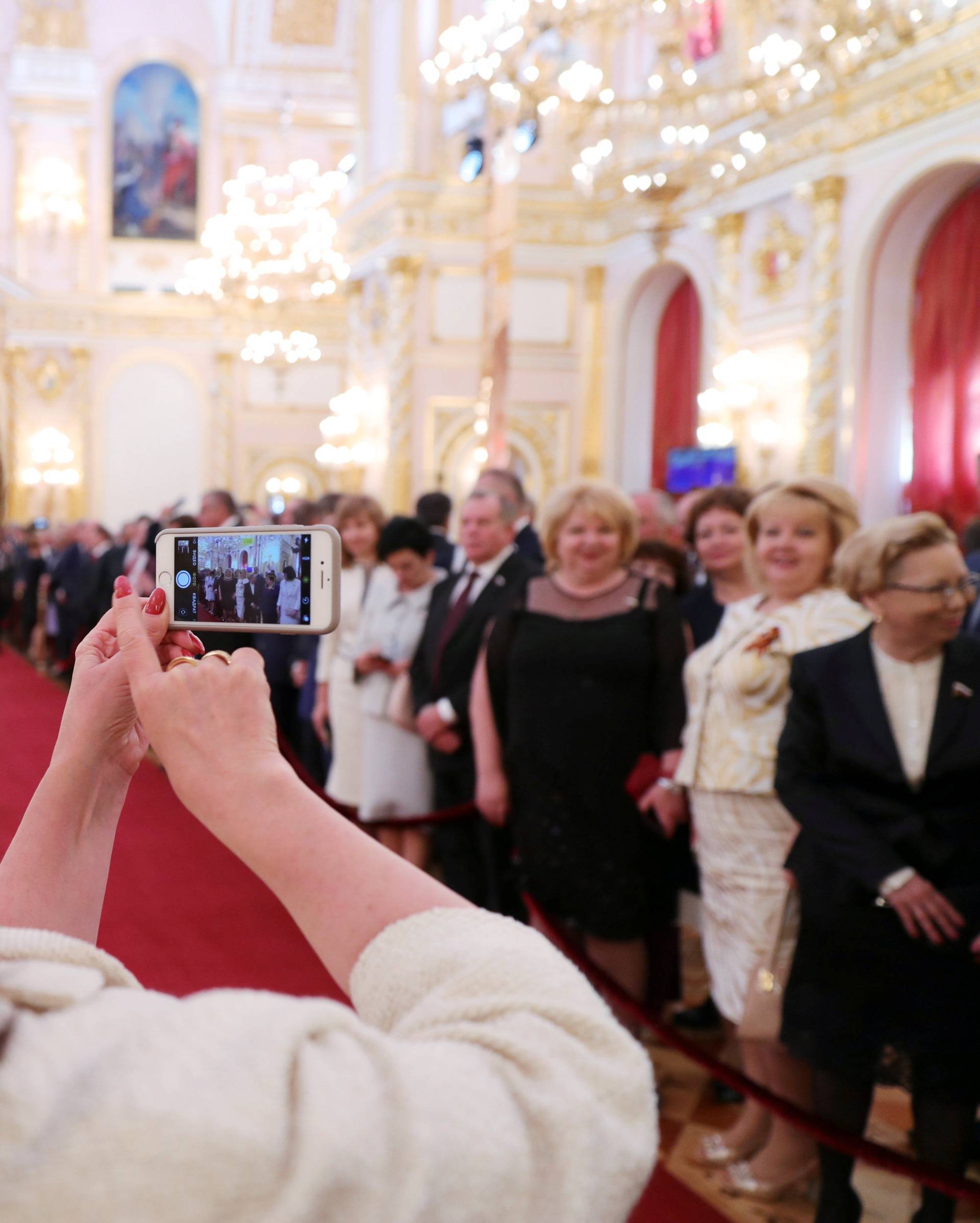 Guests gather before a ceremony to inaugurate Vladimir Putin as President of Russia at the Kremlin in Moscow