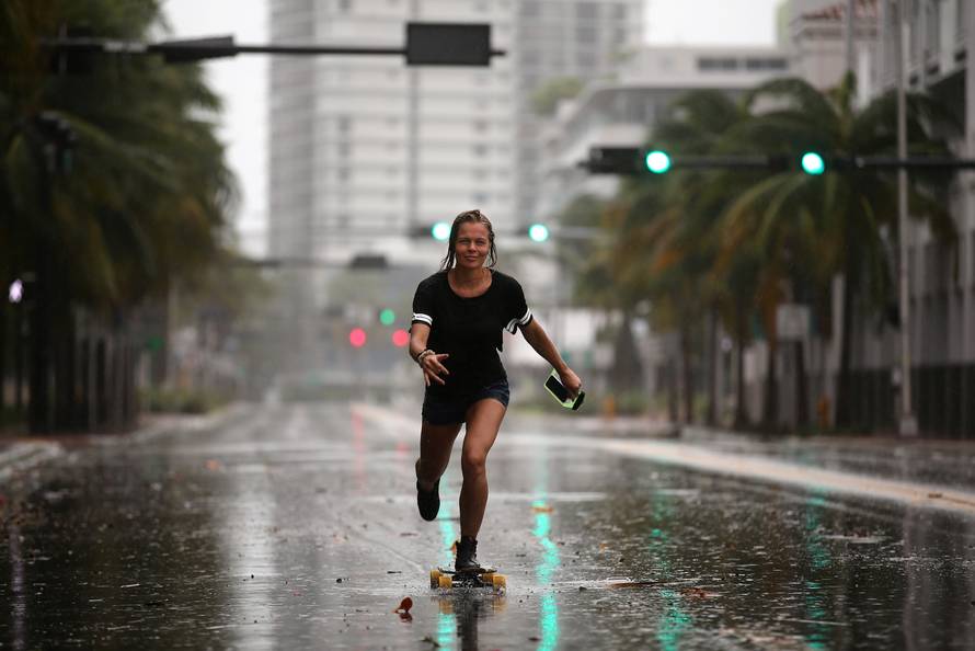 A local resident rides a skateboard before the arrival of Hurricane Irma to south Florida