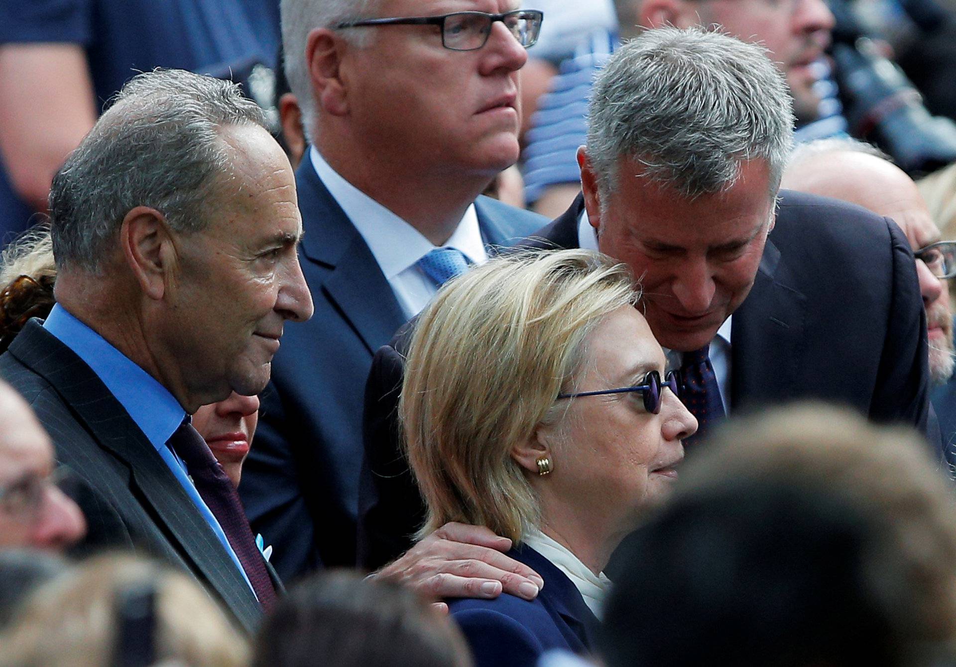 U.S. Democratic presidential candidate Hillary Clinton, New York Mayor Bill de Blasio and U.S. Senator Chuck Schumer attend ceremonies to mark the 15th anniversary of the September 11 attacks at the National 9/11 Memorial in New York