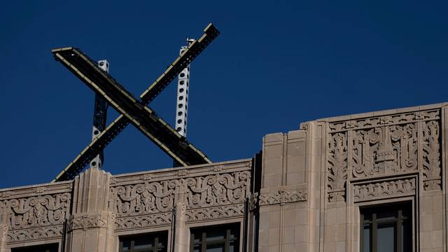 FILE PHOTO: 'X' logo is seen on the top of the headquarters of the messaging platform X, formerly known as Twitter in San Francisco