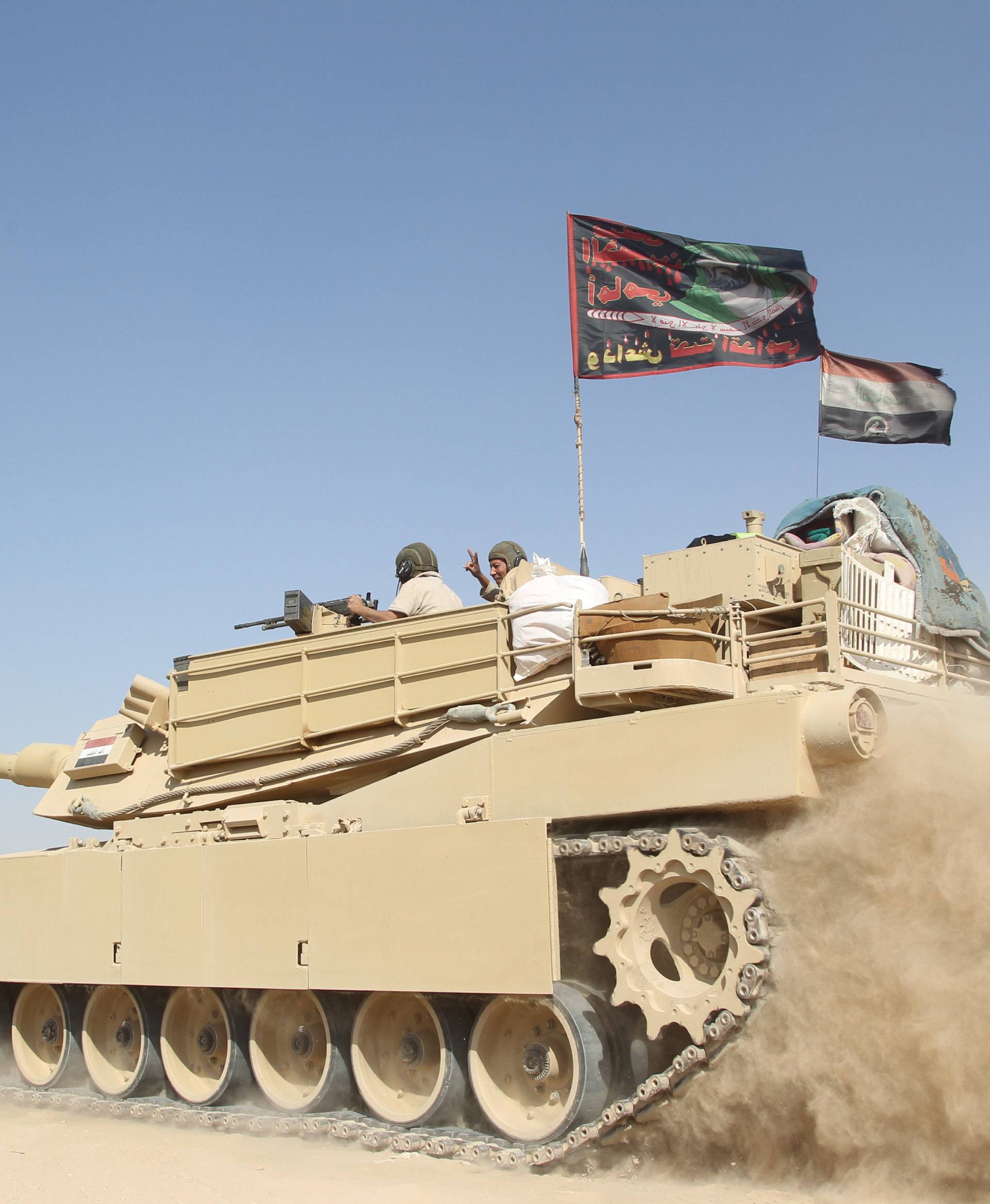 A tank of the Iraqi army drives south of Mosul
