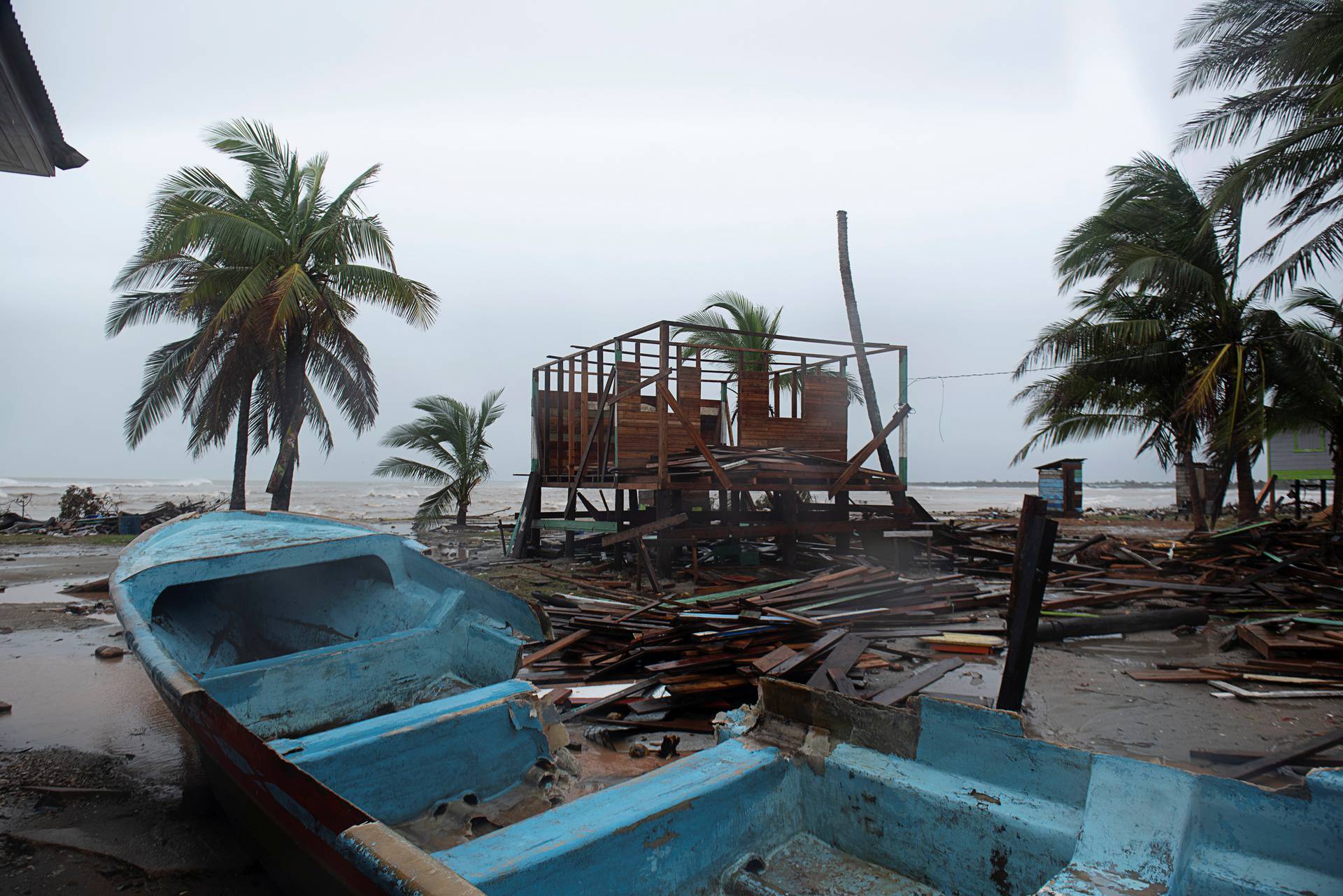 A damaged boat is seen on sand as Hurricane Iota approaches Puerto Cabezas