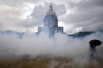 Clouds of teargas waft across the Invalides esplanade during a demonstration against French labour law reform in Paris
