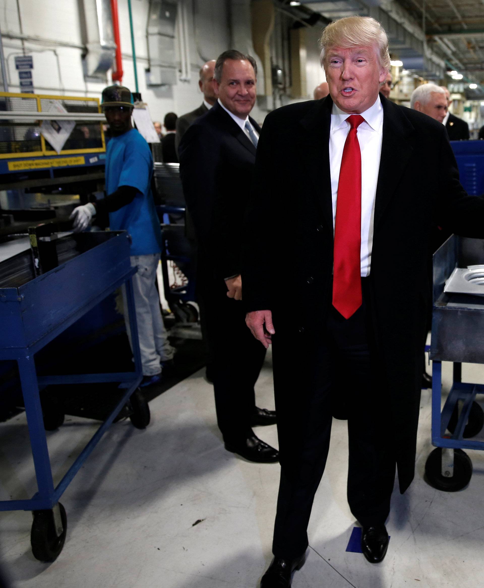 U.S. President-elect Donald Trump speaks to members of the news media as he tours a Carrier factory in Indianapolis