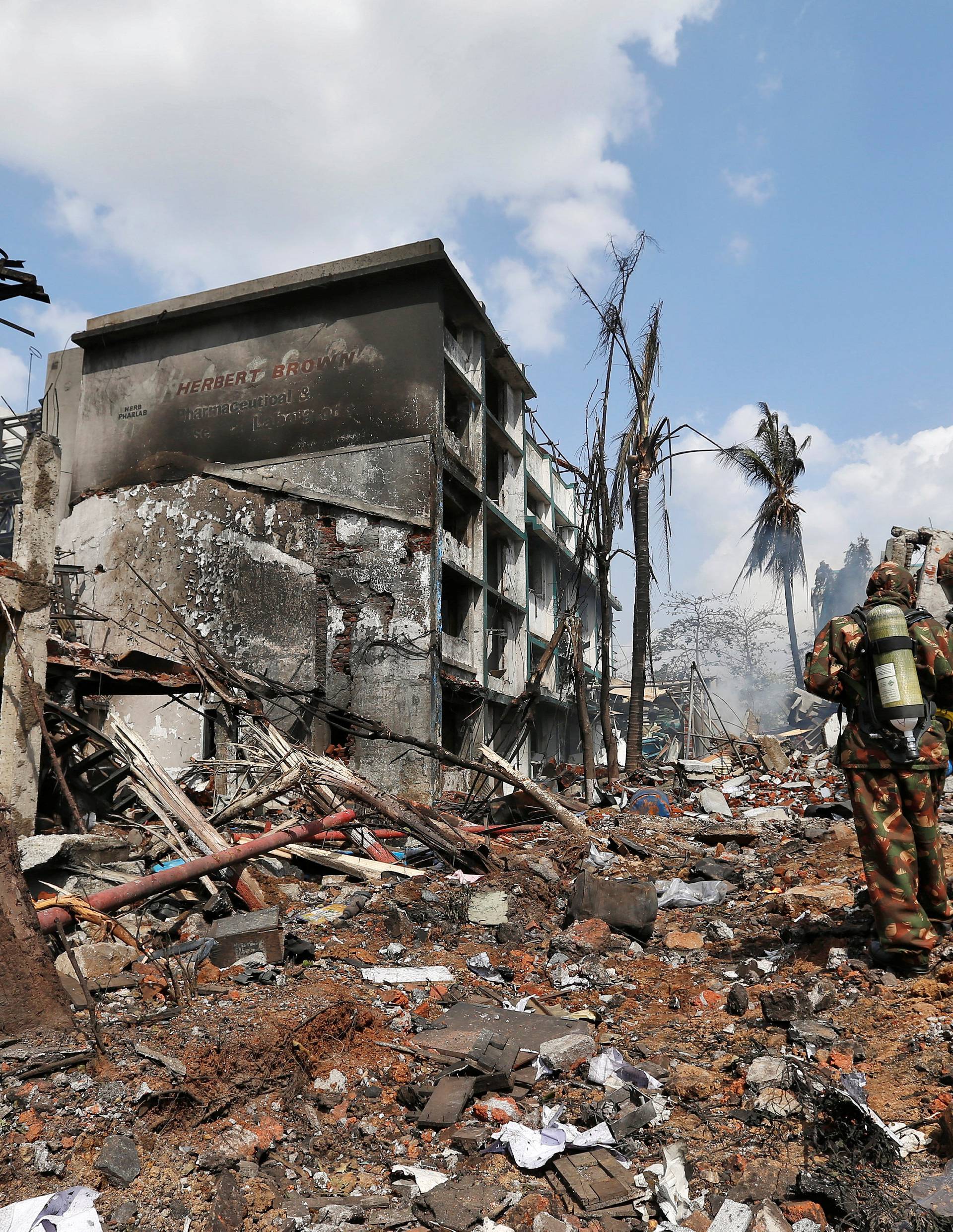 Rescue personnel work at the site of an explosion at a chemical factory in an industrial area in Dombivali