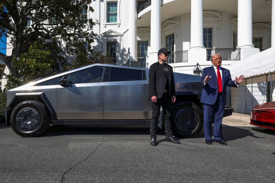 U.S. President Donald Trump views a Tesla car at the White House in Washington