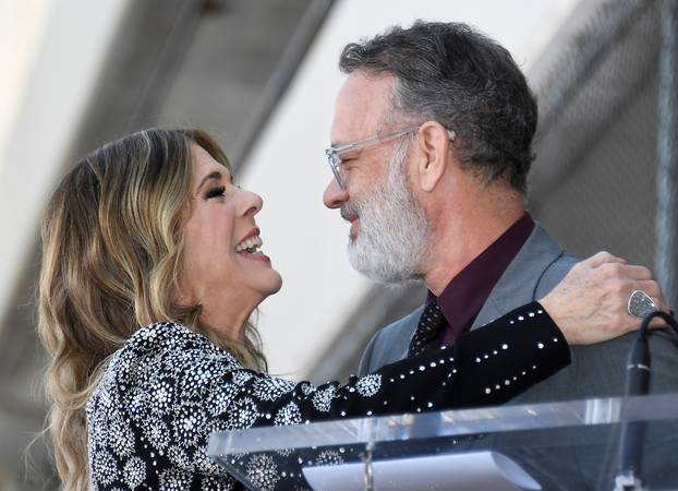 Actor Rita Wilson and husband Tom Hanks embrance during a ceremony honoring Wilson with a star on Hollywood