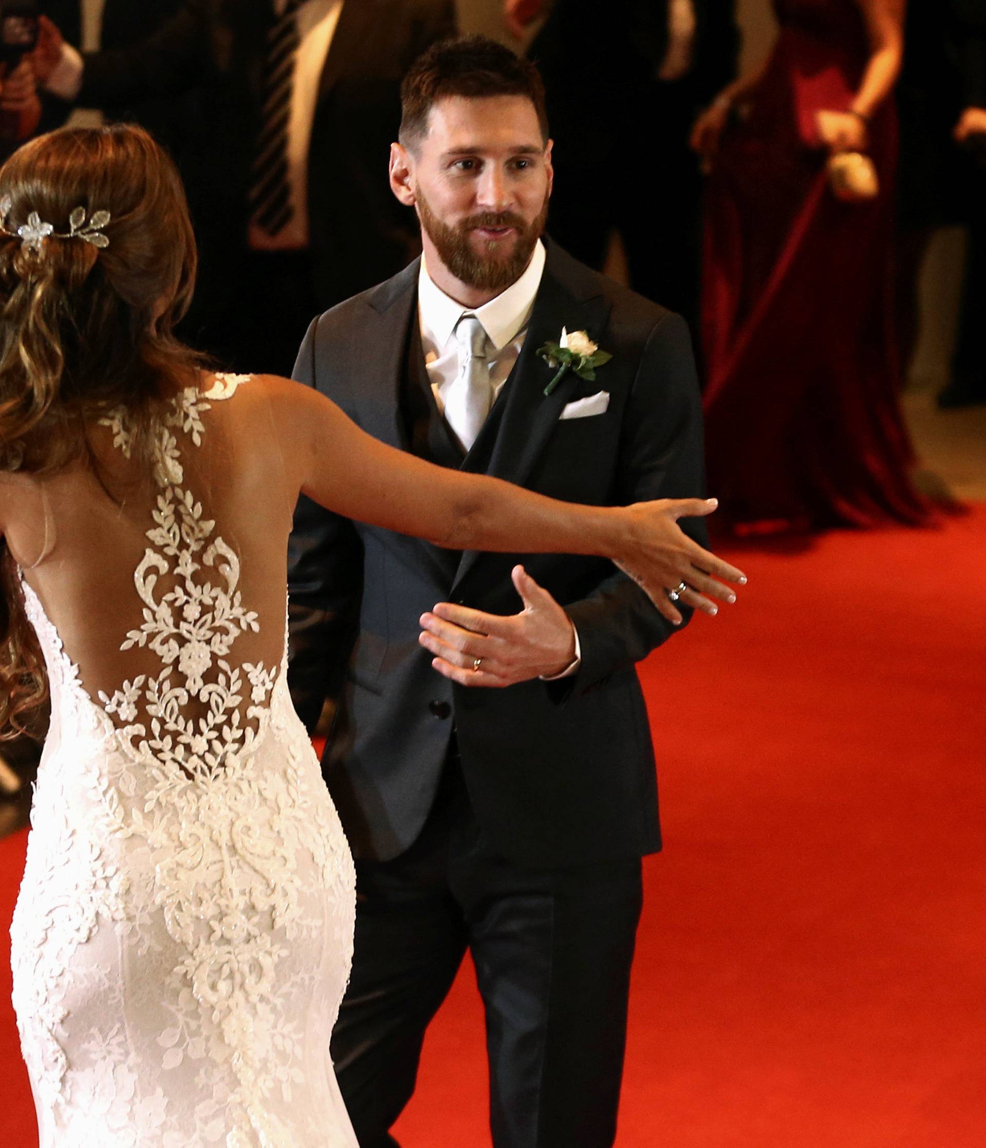 Argentine soccer player Lionel Messi and his wife Antonela Roccuzzo make an appearance for the press at their wedding in Rosario