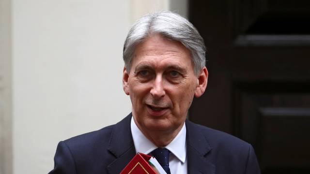 Britain's Chancellor of the Exchequer Philip Hammond is seen outside Downing Street in London