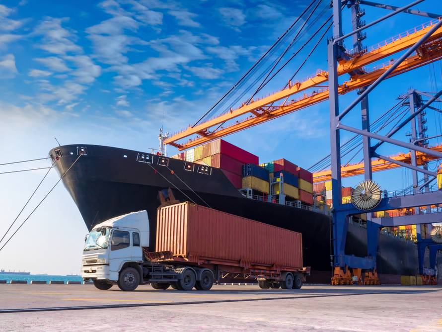 The,Container,Vessel,During,Discharging,At,An,Industrial,Port,And