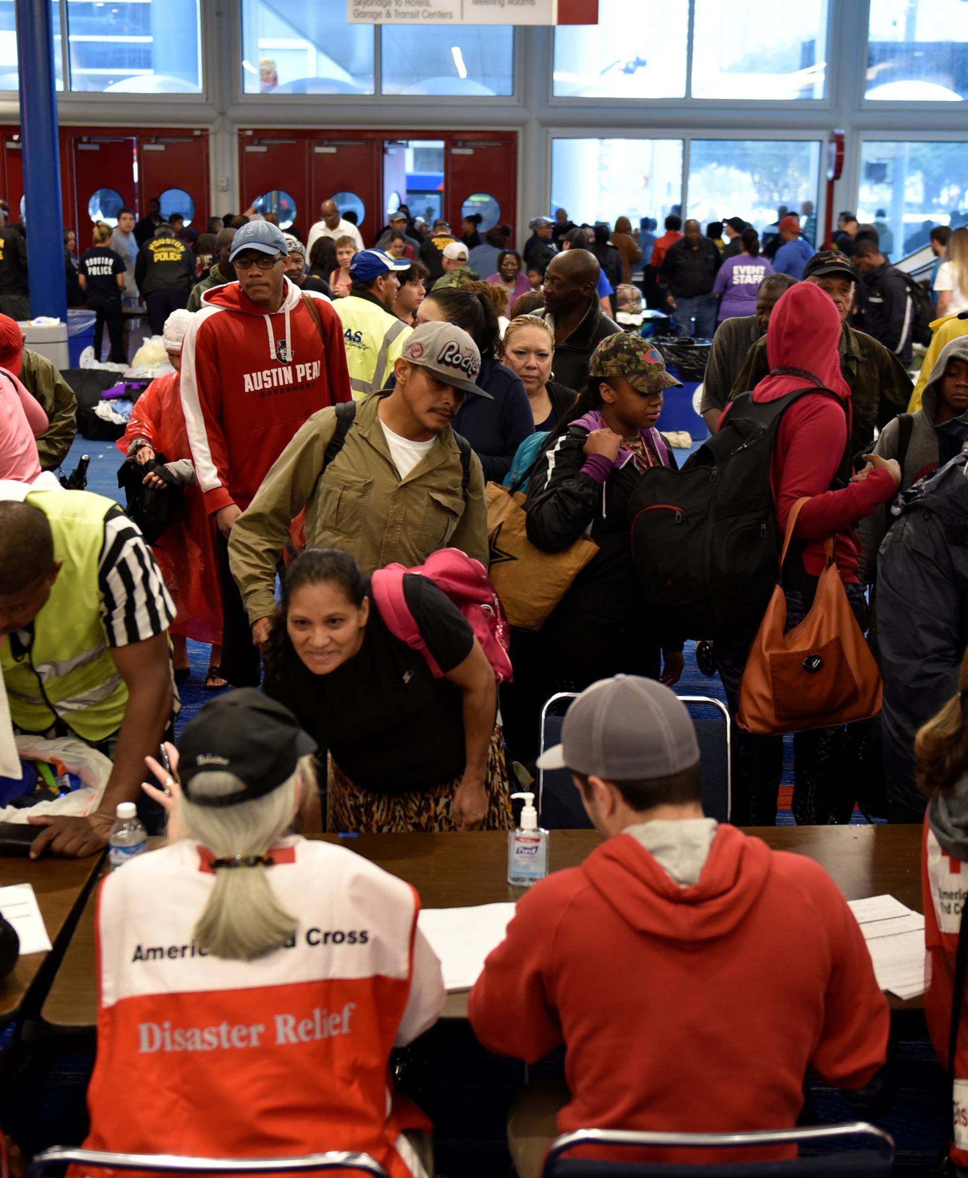 Volunteers with The American Red Cross register evacuees at the George R. Brown Convention Center after Hurricane Harvey inundated the Texas Gulf coast with rain causing widespread flooding, in Houston