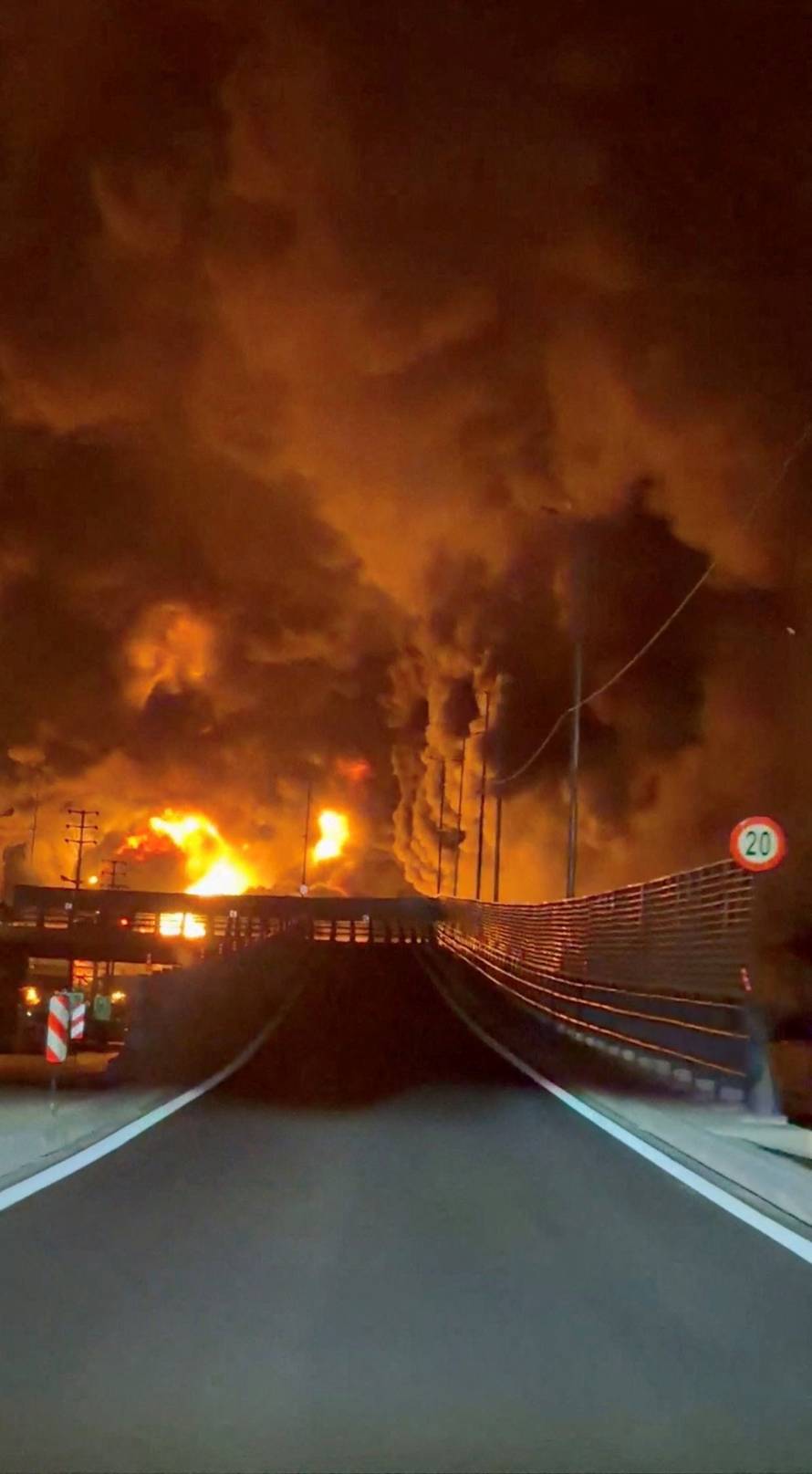 Fire burns and smoke rises from Aqdasieh Oil Depot in Tehran