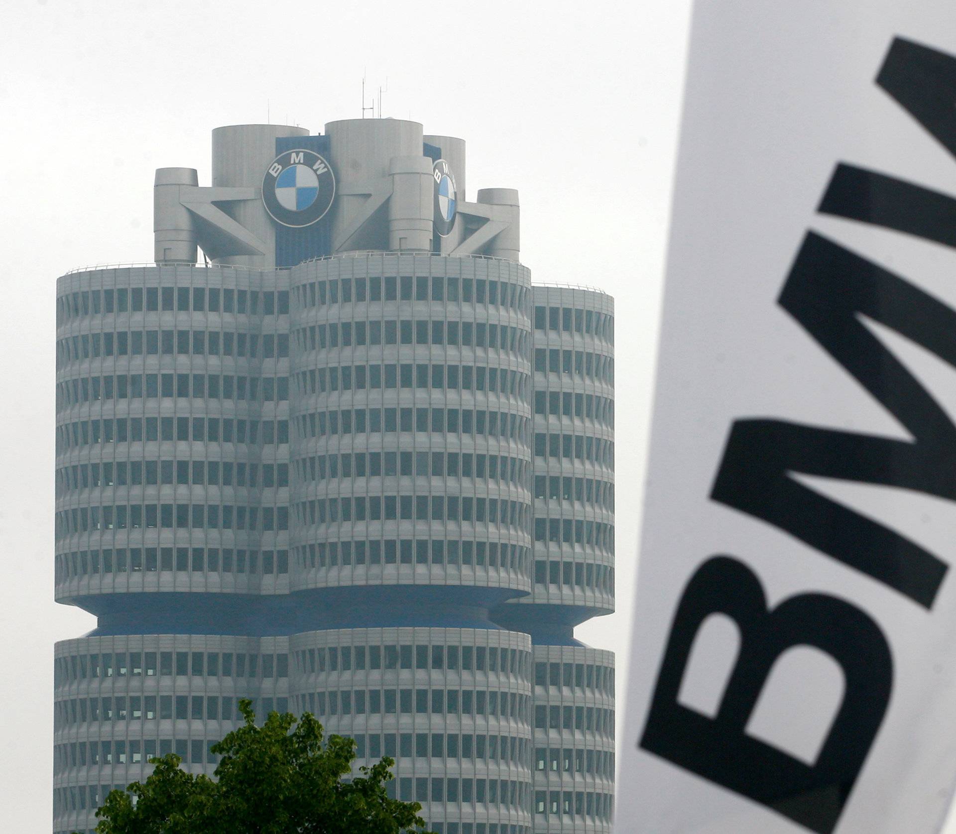 FILE PHOTO: A BMW flag is seen next to the BMW headquarter before the company's annual shareholders meeting in Munich