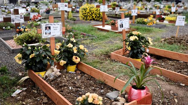 FILE PHOTO: Graves of people who had recently died due to COVID-19 are seen at the cemetery of Nembro, near Bergamo