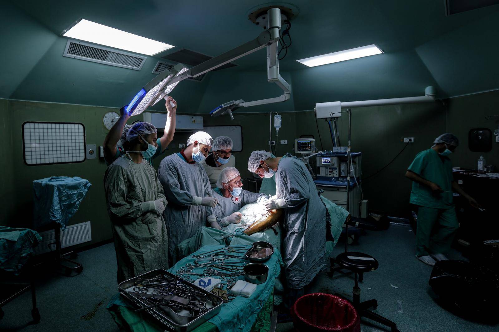 British vascular surgeon John Wolfe performs a surgery in Gaza