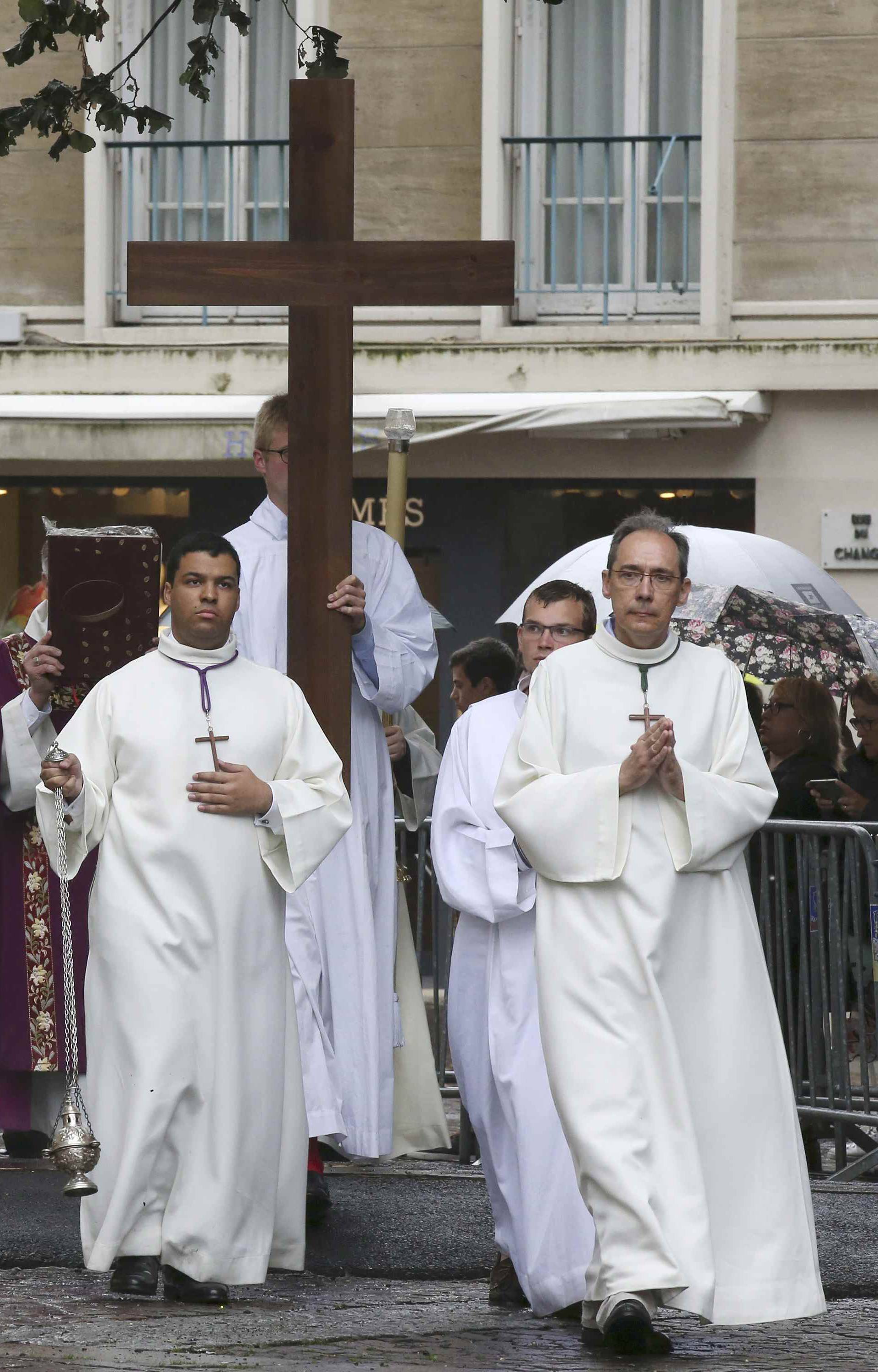 Priests lead a procession for a funeral service for slain French parish priest Father Jacques Hamel at the Cathedral in Rouen
