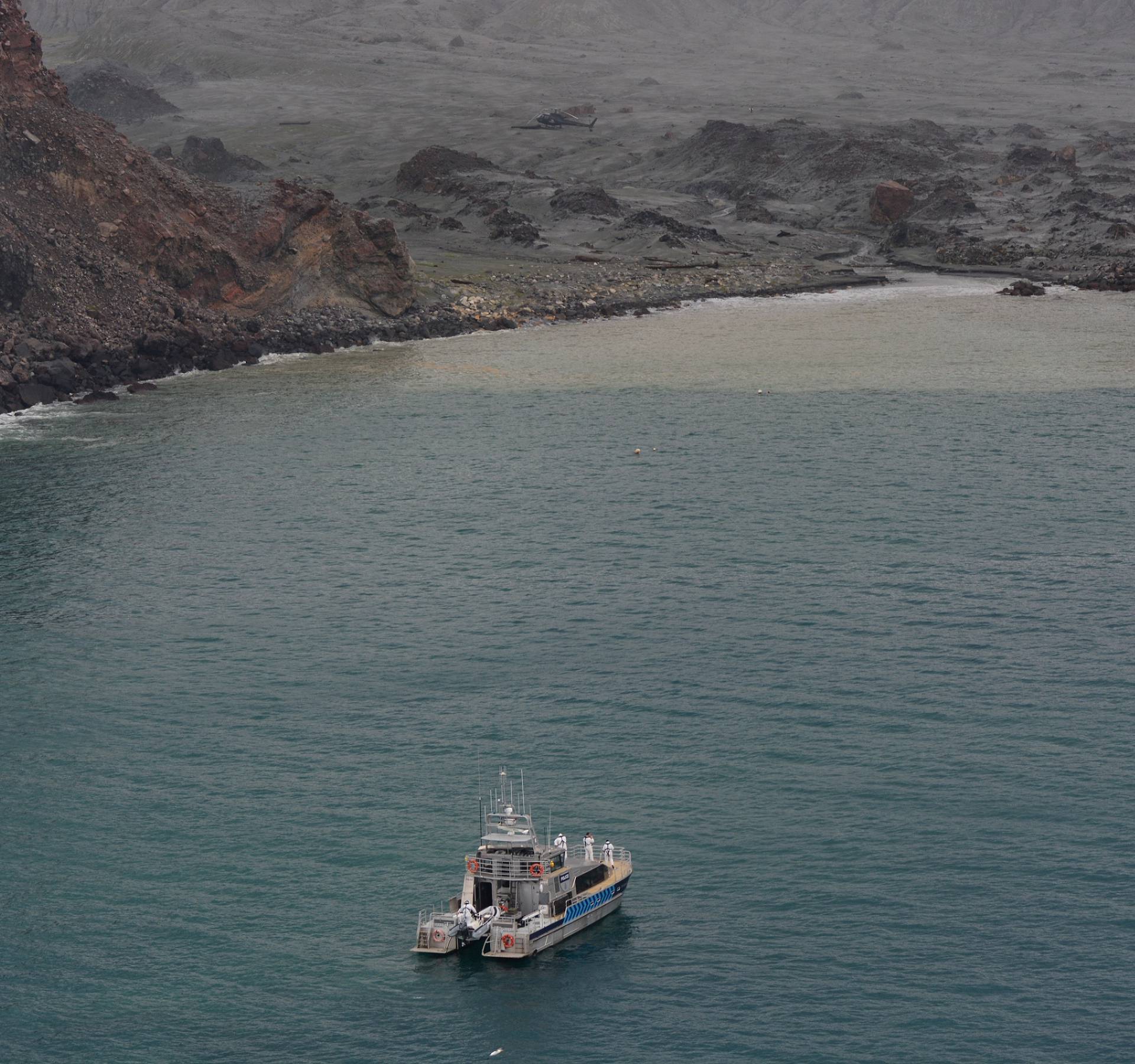 Rescue crew are seen at the White Island volcano in New Zealand