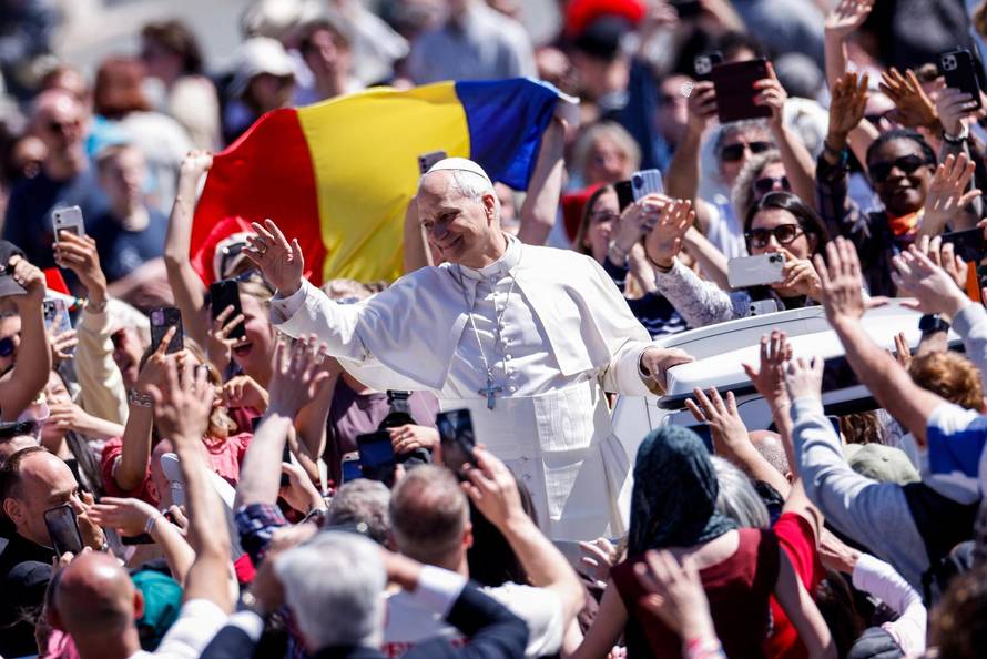 Pope Leo XIV delivers his "Urbi et Orbi" (To the city and the world) message from the main balcony of St. Peter's Basilica