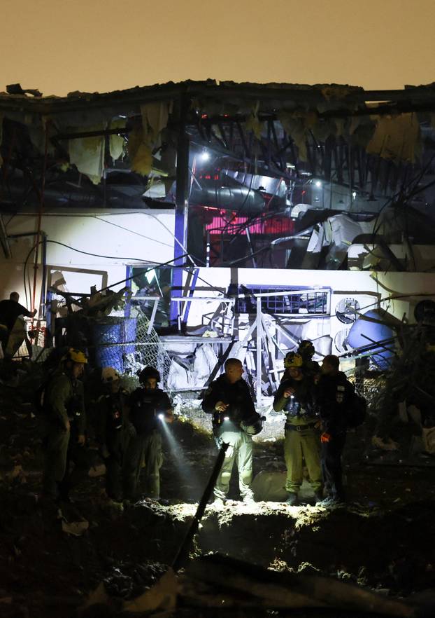 The site of damage after a barrage of Iranian missiles was launched at Israel, amid the U.S.-Israel conflict with Iran, in Petah Tikva