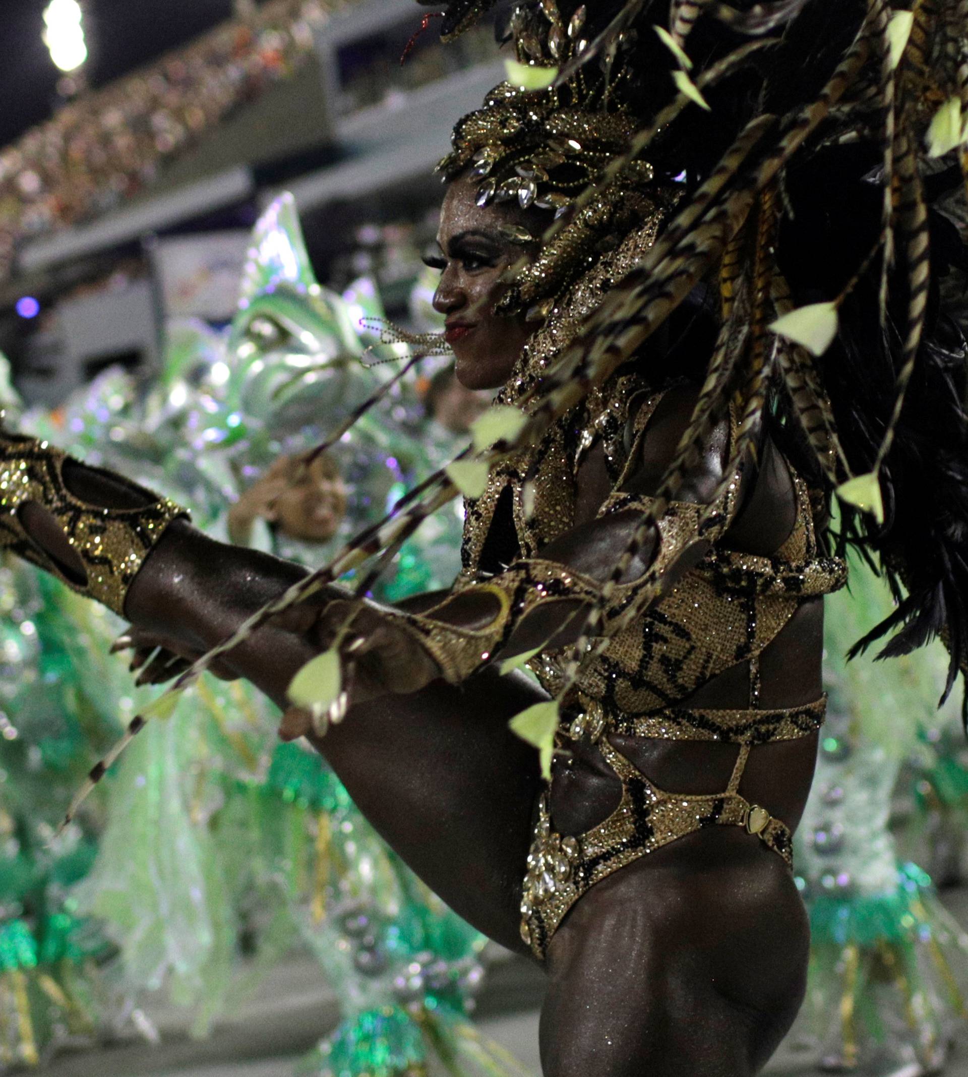 A reveller from Imperatriz performs during the second night of the Carnival parade at the Sambadrome in Rio de Janeiro
