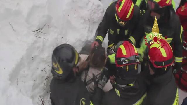Firefighters rescue a survivor from Hotel Rigopiano in Farindola