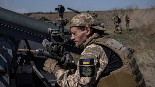 Ukrainian serviceman points a small MLRS before firing toward Russian troops near a front line in Zaporizhzhia region