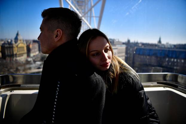 Ukrainian and Russian couple who fled Ukraine in Budapest