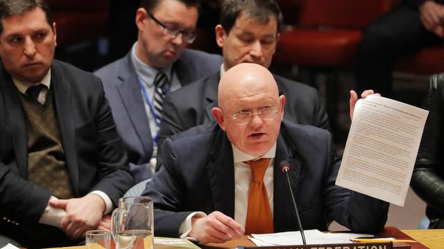 Russian Ambassador to the U.N. Vasily Nebenzya holds a paper up as he speaks regarding an incident in Salisbury, during a meeting of the U.N. Security Council at U.N. headquarters in New York