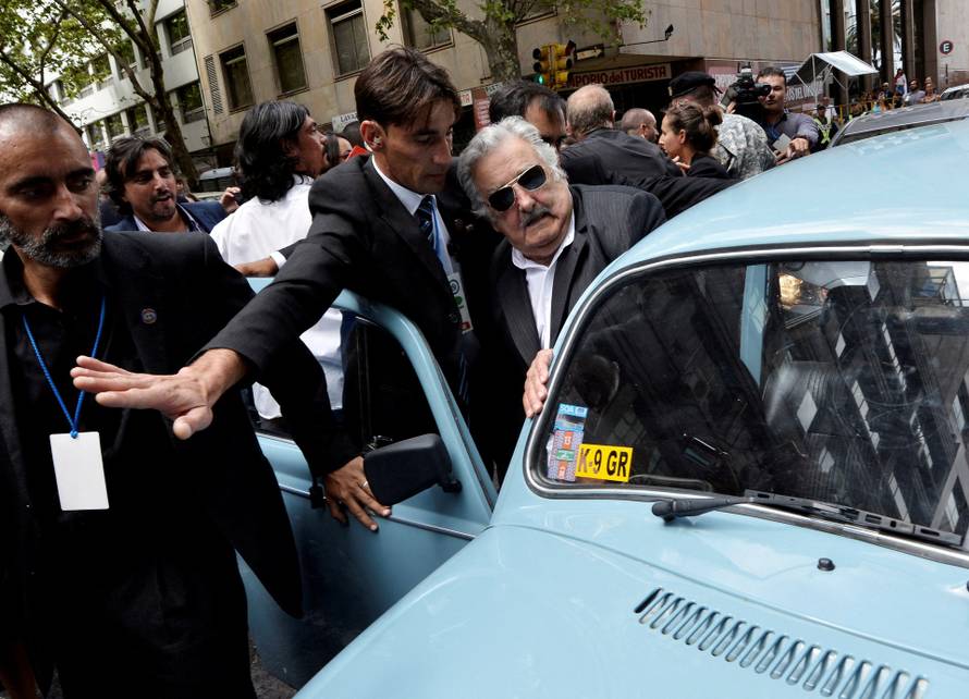 FILE PHOTO: Jose Mujica gets into his Volkswagen Beetle after handing over the presidential sash to Tabare Vazquez in Montevideo