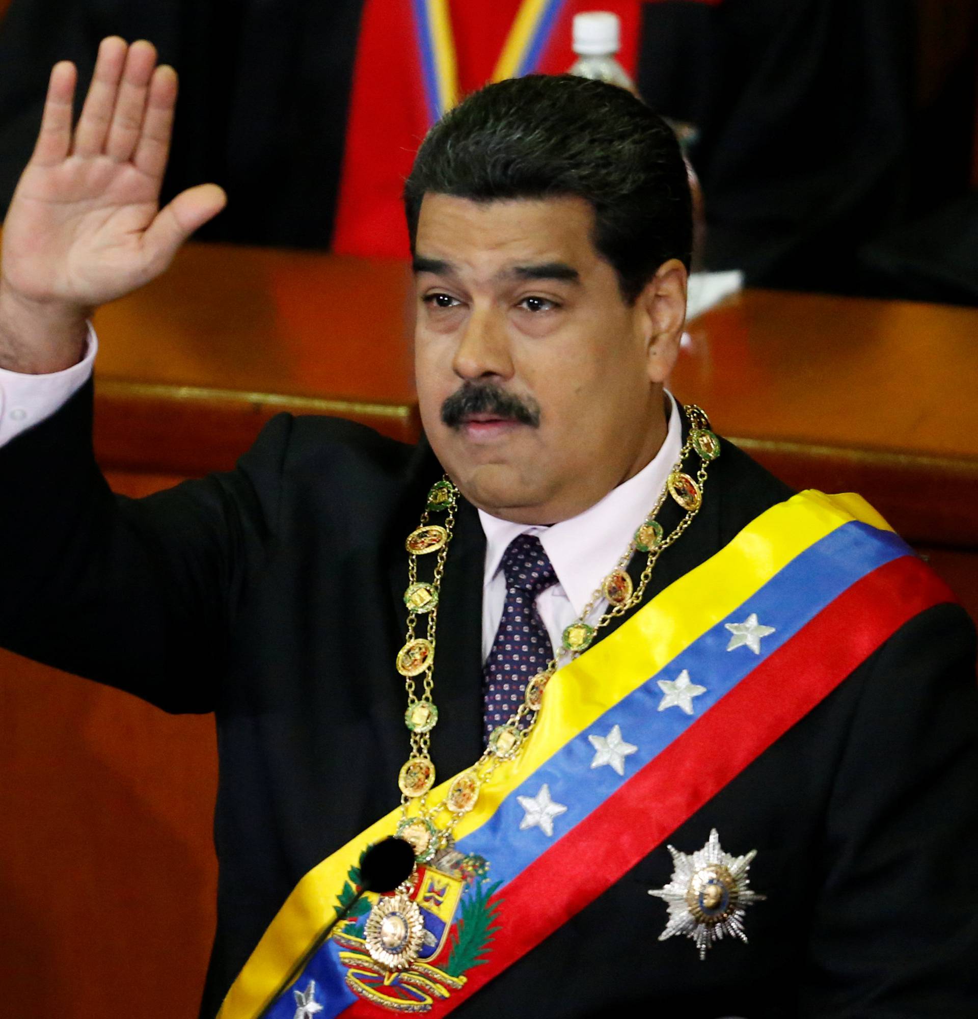 Venezuela's President Maduro waves during his annual report of the state of the nation at the Supreme Court in Caracas