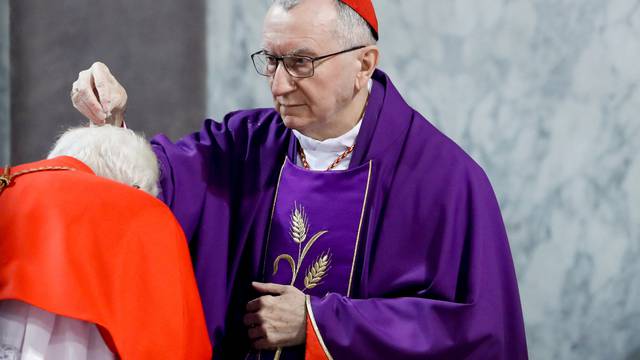 Vatican's Secretary of State puts ashes on a cardinal's head in Rome