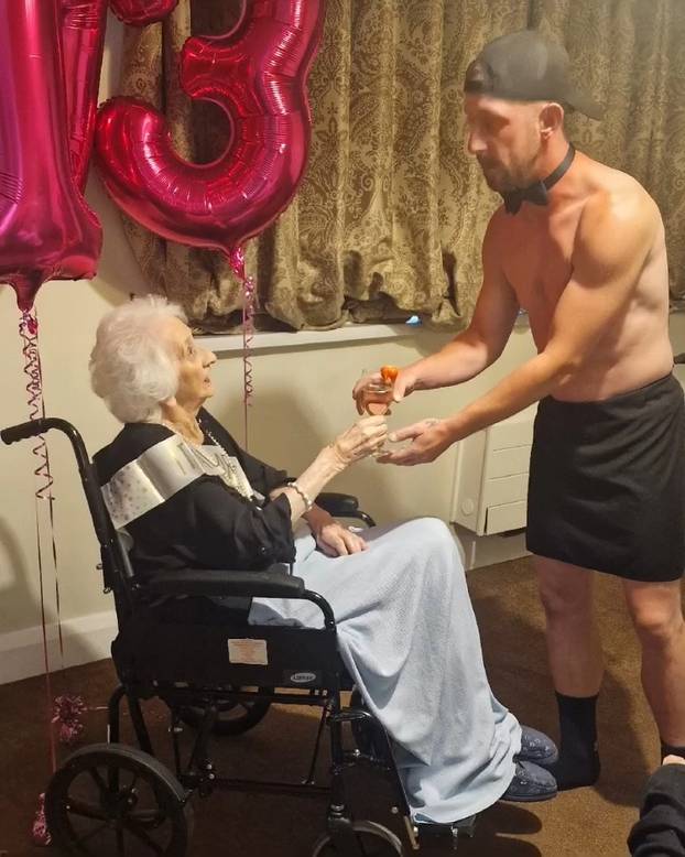 Tea and beef-cake! OAP gets Butler in the Buff for her 103rd birthday at care home