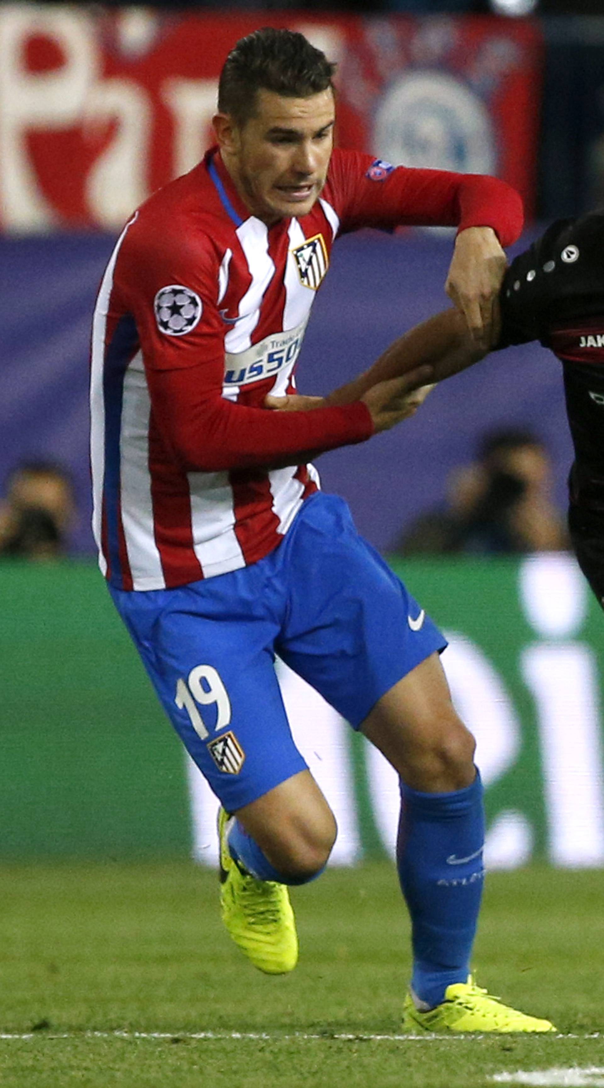 Atletico Madrid's Lucas Hernandez in action with Bayer Leverkusen's Karim Bellarabi