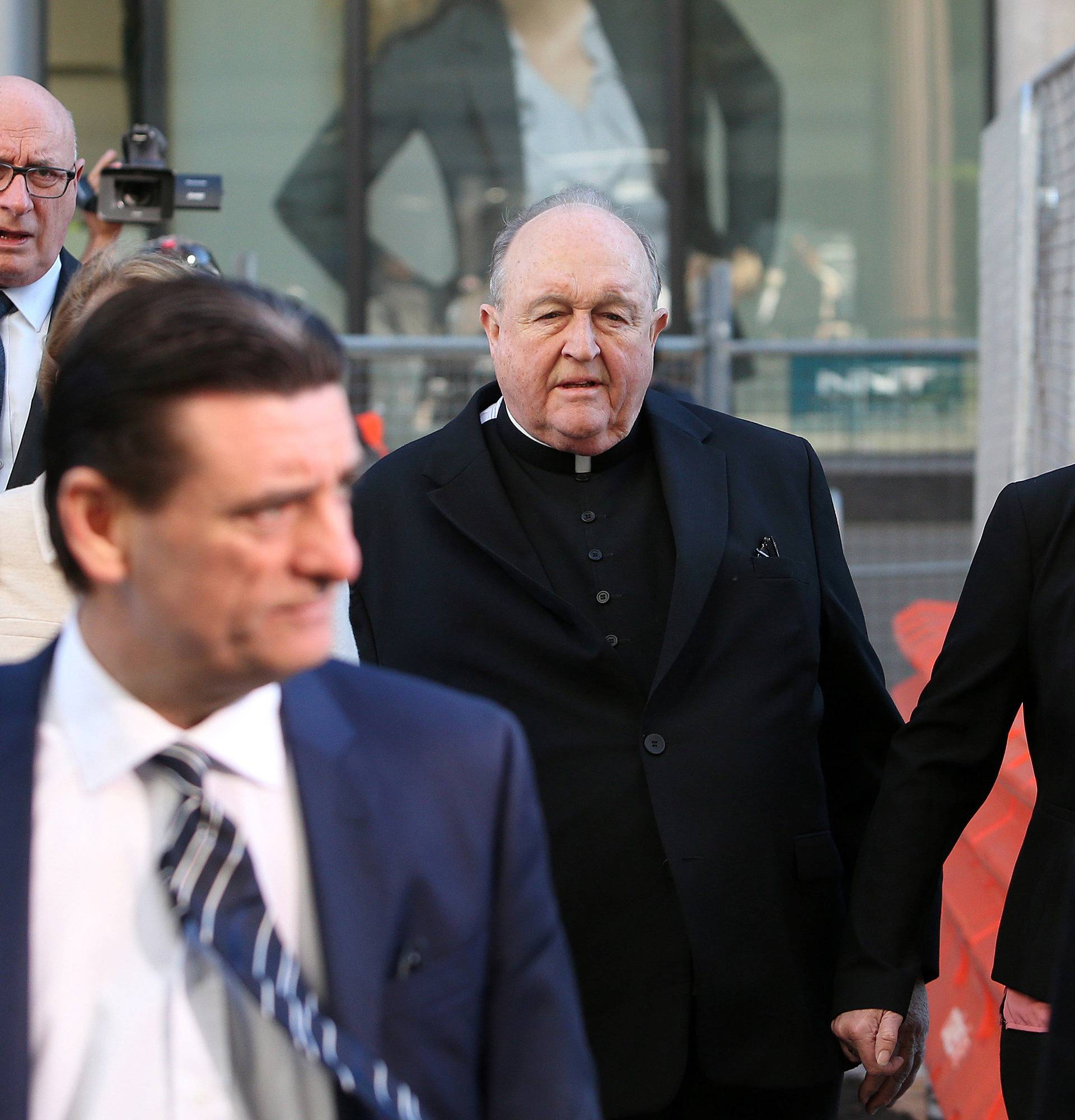 Archbishop Philip Wilson arrives at Newcastle Local Court