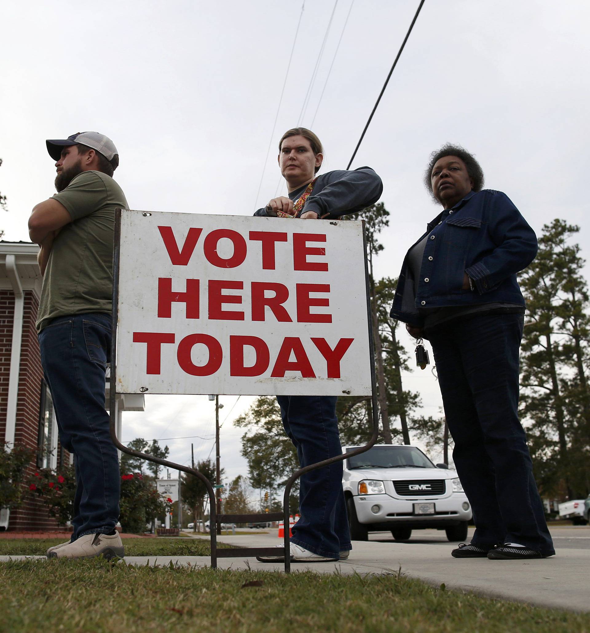 People wait in line to cast their ballots at the Aynor Town Hall during the U.S. presidential election in Aynor