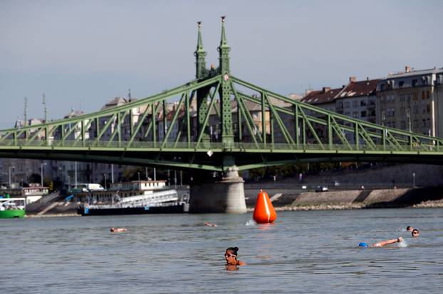 Participants swim across the Danube River during the Budapest Urban Games in Budapest