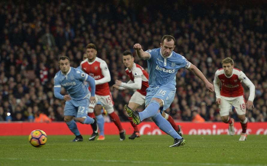 Stoke City's Charlie Adam scores their first goal from the penalty spot