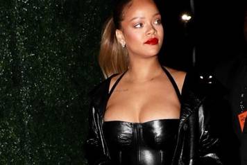 Rihanna wears a revealing little black dress to Jay-Z's show at The Forum