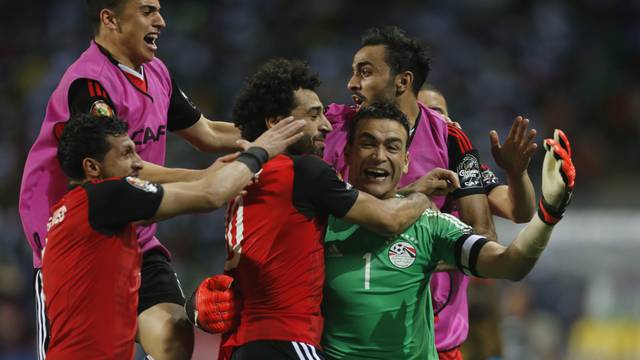 Egypt's Essam El-Hadary celebrates with team mates after the game