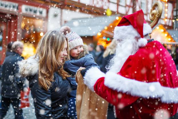 Cute,Toddler,Girl,With,Mother,On,Christmas,Market.,Funny,Happy